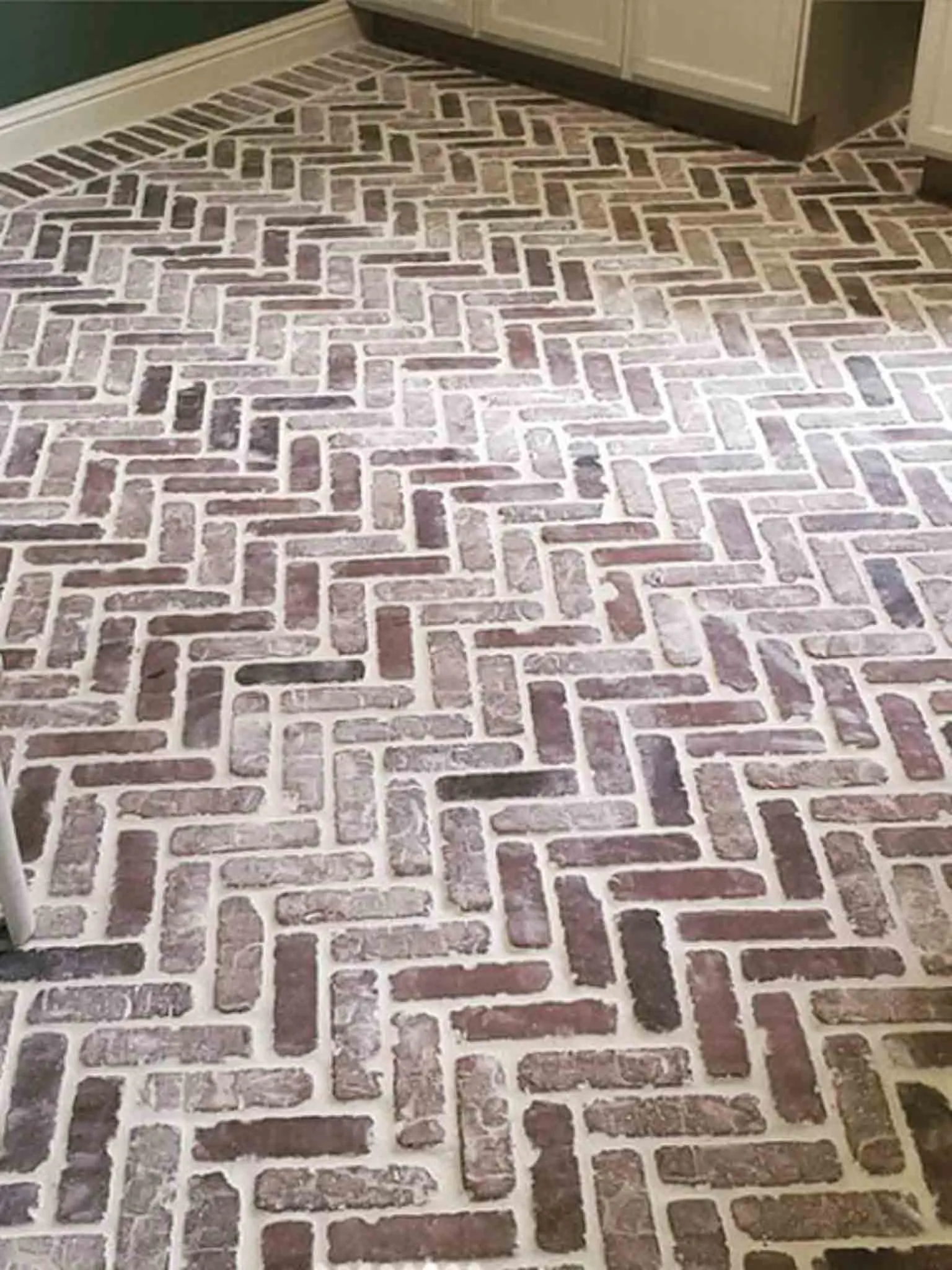 Herringbone brick-look tile floor