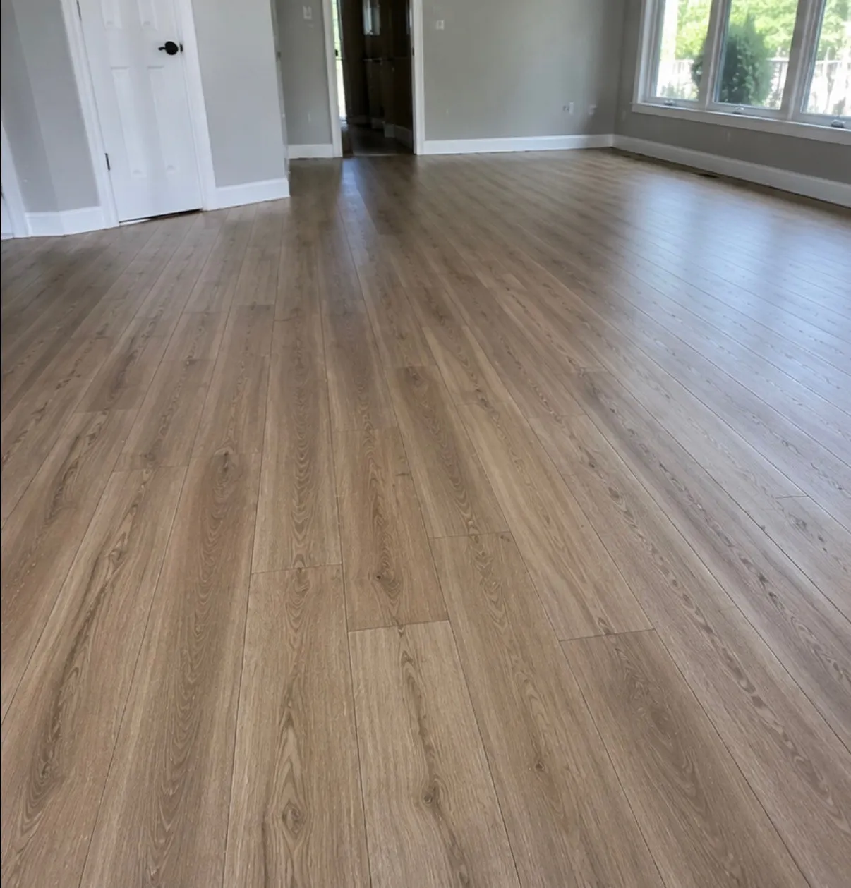 Newly installed wood-look luxury vinyl plank across an open living area in Everett